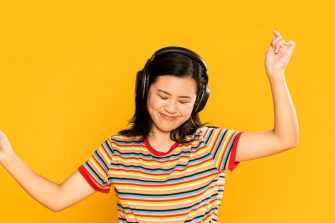 Young woman with headphones dancing 