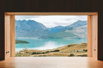 View of mountains and lake through a window