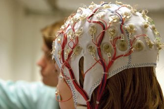 A student and clinician in a neuroscience lab