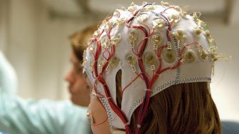 A student and clinician in a neuroscience lab