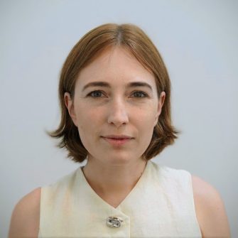Grey background Centered headshot of Elva Darnell