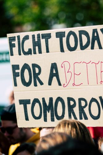 Heavy traffic on a busy street in Tehran, Iran, with the iconic Milad Tower in the background. 