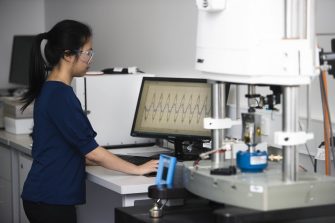 Woman working at computer in lab