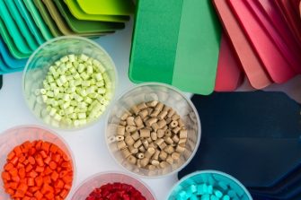 Several dyed plastic polymer granulates in laboratory