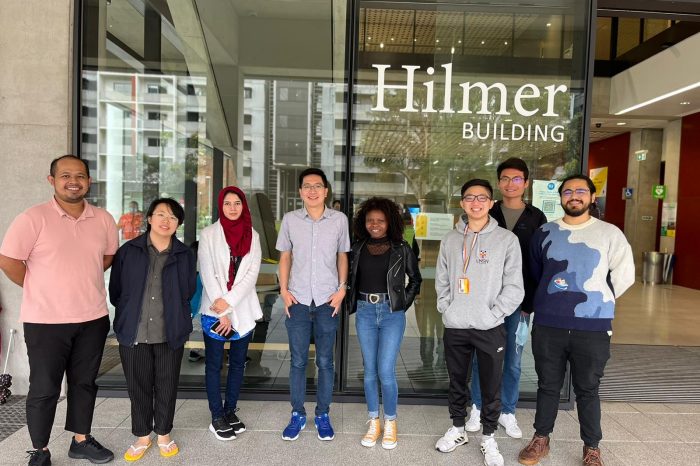 Group photo of students from the School of Chemistry standing in front of the Hilmer Building