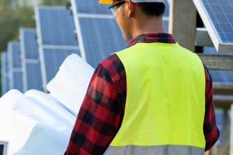 construction workers looking at plans