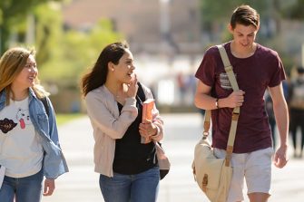 Three students walking together