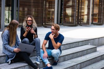 Students sitting on steps talking