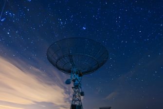 satellite dish under a starry sky