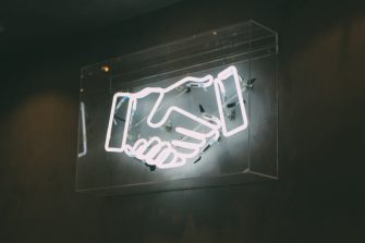 Neon sign handshake