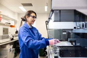 Lab personnel using array sequencer