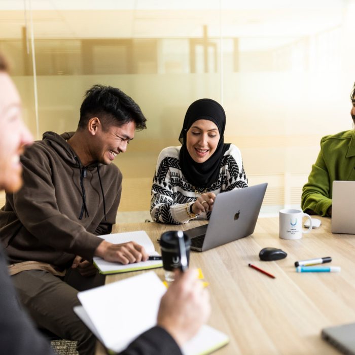 uDASH Staff collaborating in Boardroom
