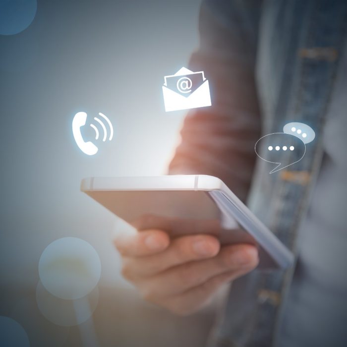 CONTACT US, Hand of a businessman holding a mobile smartphone with the icon. Contact us connection concept with copy space.