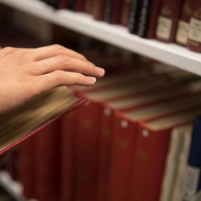 Hand on books in library