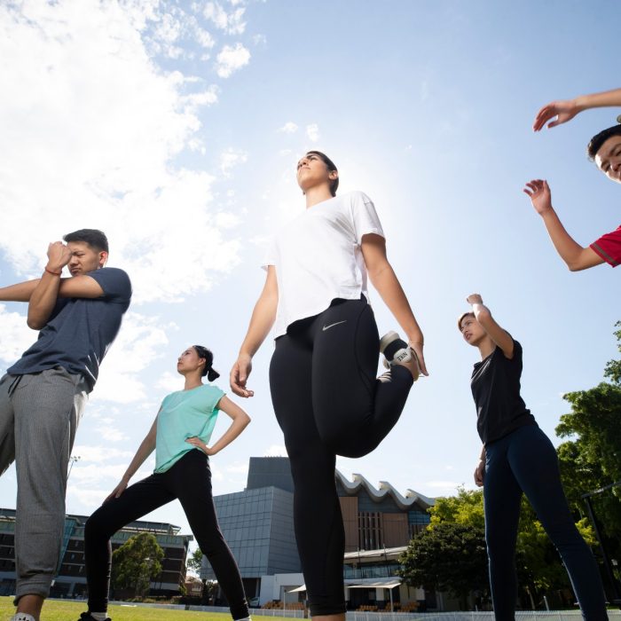 Students stretching on Village Green