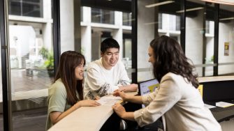 Student Services helping students at desk