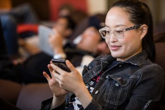 Female student looking at mobile phone