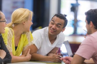 Students at desk talking