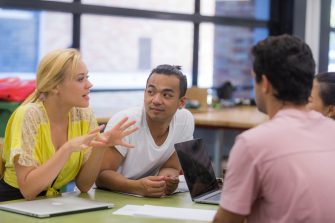 Students at desk talking