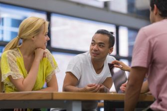 Students at desk talking