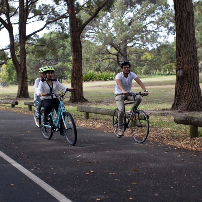 Students riding bikes in Centennial Park