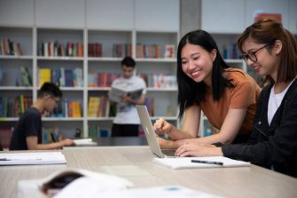 Students studying with books and laptops in the Library Support Unit (LSU)