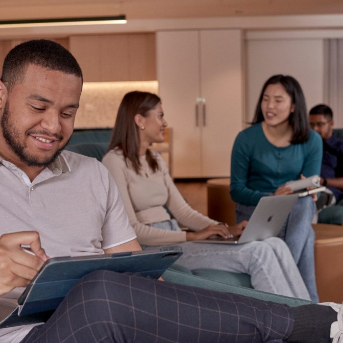 Students relaxing and studying in the common lounge at UNSW Kensington accommodation.