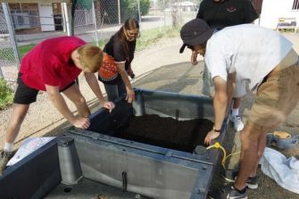 Kim Sullivan from the DEG and Steven Dennis learning how to assemble the new beds. Image supplied.