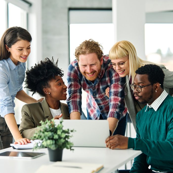 Group of young business people using laptop having a meeting or presentation and seminar in the office