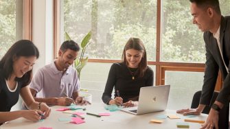 Student and career mentors talking in a meeting room at UNSW.