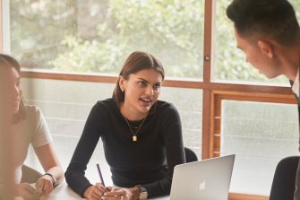 Student and career mentors talking in a meeting room at UNSW.