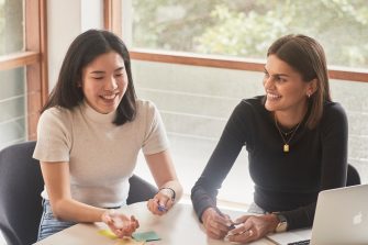 Student and career mentors talking in a meeting room at UNSW.