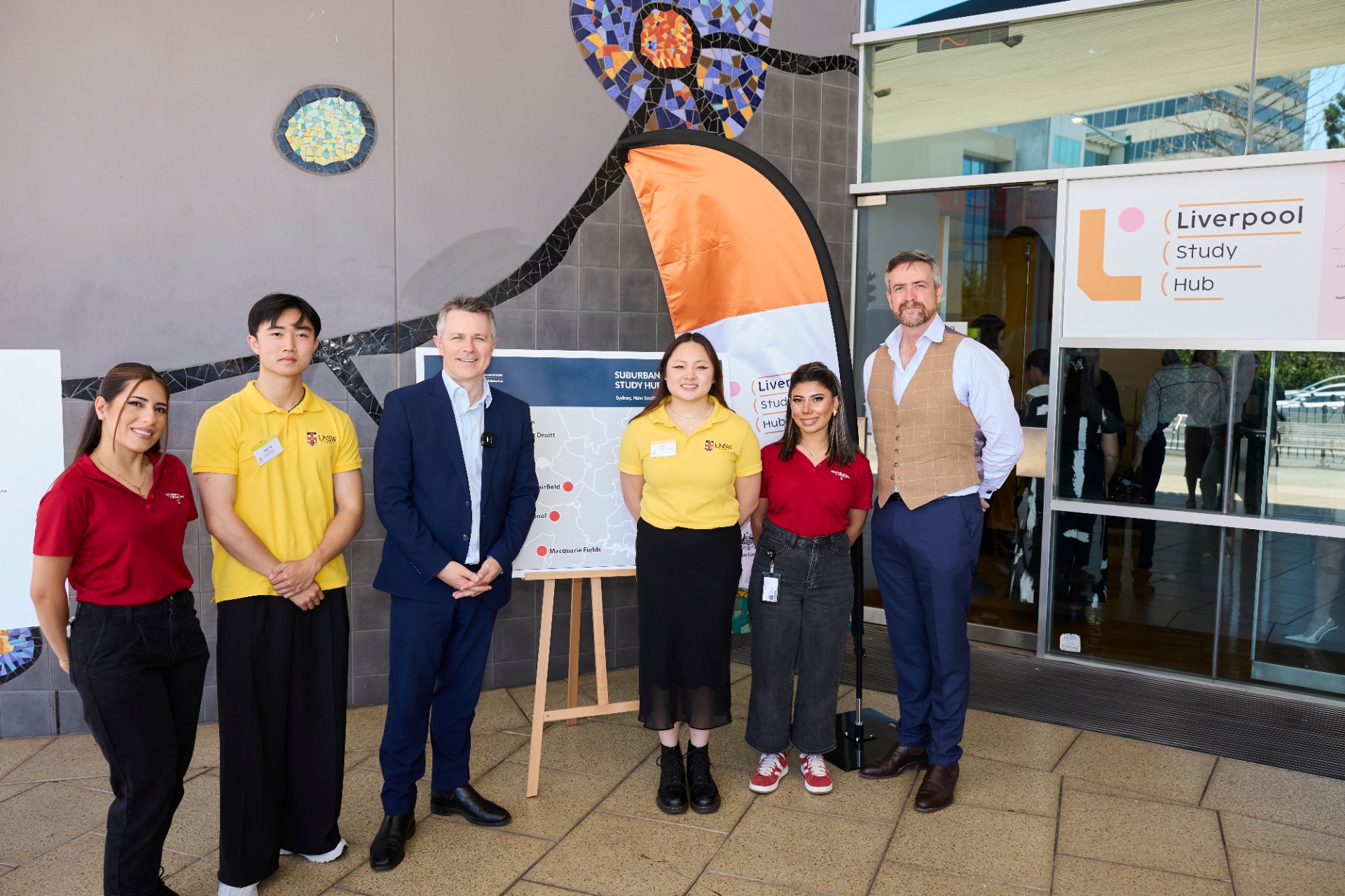 Federal Education Minister Jason Clare (centre) and UNSW Vice-Chancellor and President Professor Attila Brungs (right) with students at the Liverpool Study Hub.