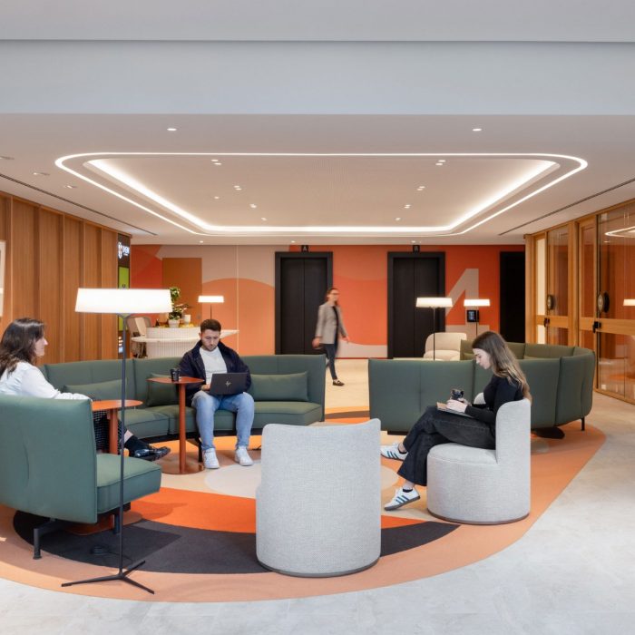 students studying on lounges in building