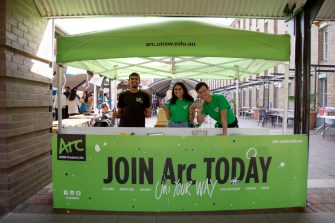 Photograph of potential students socialising and browsing the UNSW campus