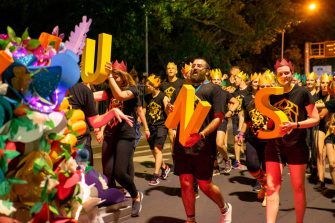 Photograph of peoplrin the mardi gras parade
