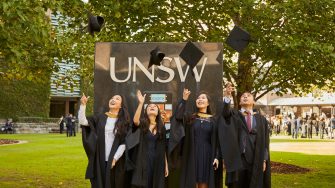 Students and family celebrate graduation.