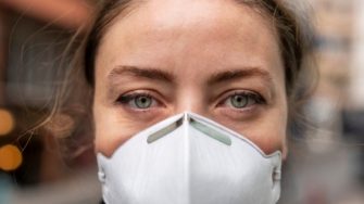 Portrait of young person wearing a facial mask