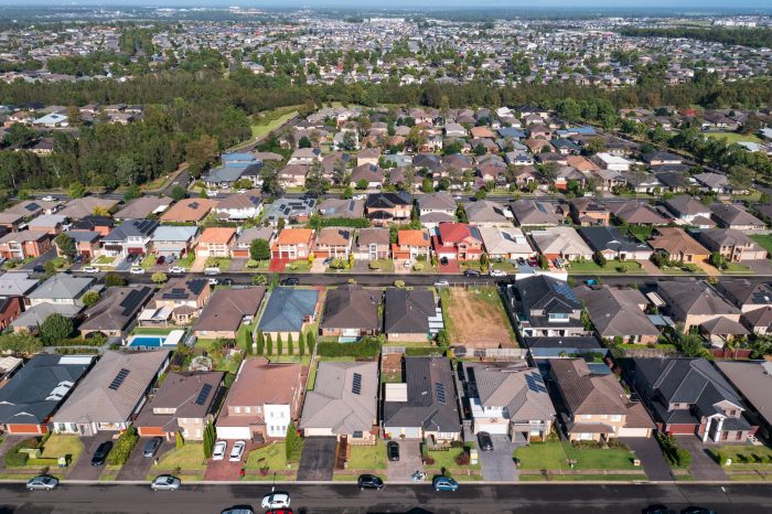 Aerial view of rows of typical homes built during the 2010s in outer suburban Sydney, Australia.