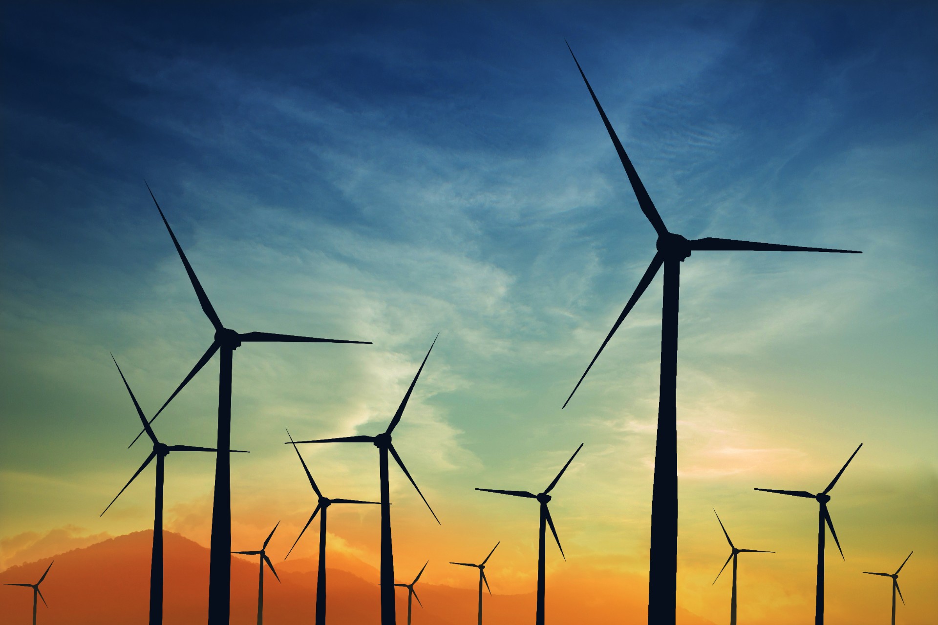 concept idea eco power energy. wind turbine on hill with sunset