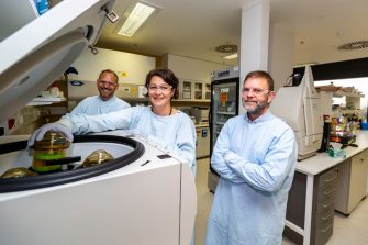 Senior authors Mee Ling Munier (middle) and Anthony Kelleher (right) in the Kirby Institute laboratories with Stuart Turville. Credit: Kirby Institute