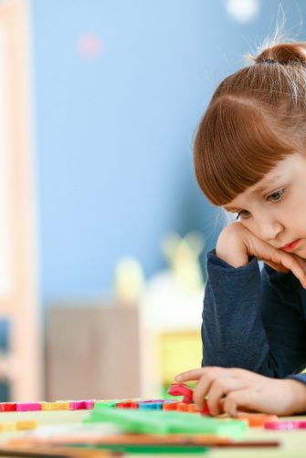 Little girl with autistic disorder in playroom
