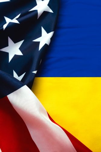 American flag and National flag of Ukraine background