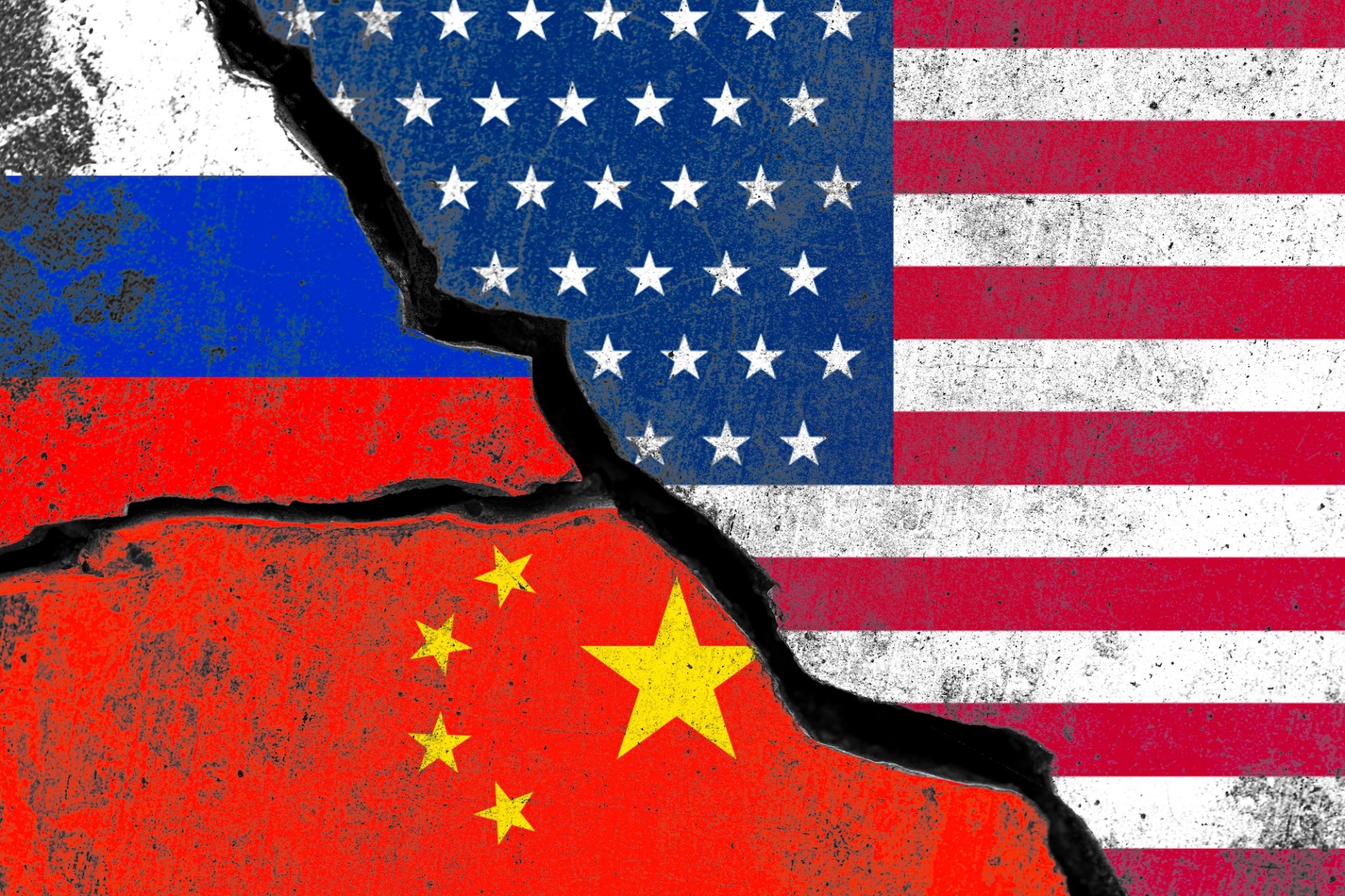 Russia  China and USA flag print screen on wall crack for military conflict and attack concept.