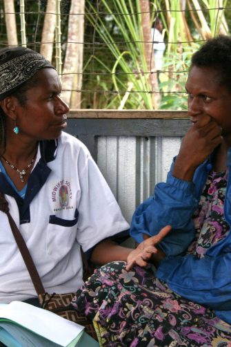 Research nurse explains study procedures, Papua New Guinea. 