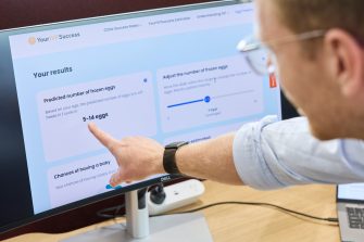 A man pointing to a computer screen.