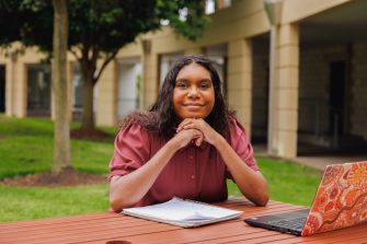 Portrait Of Female Aboriginal Australian Student On University Campus
