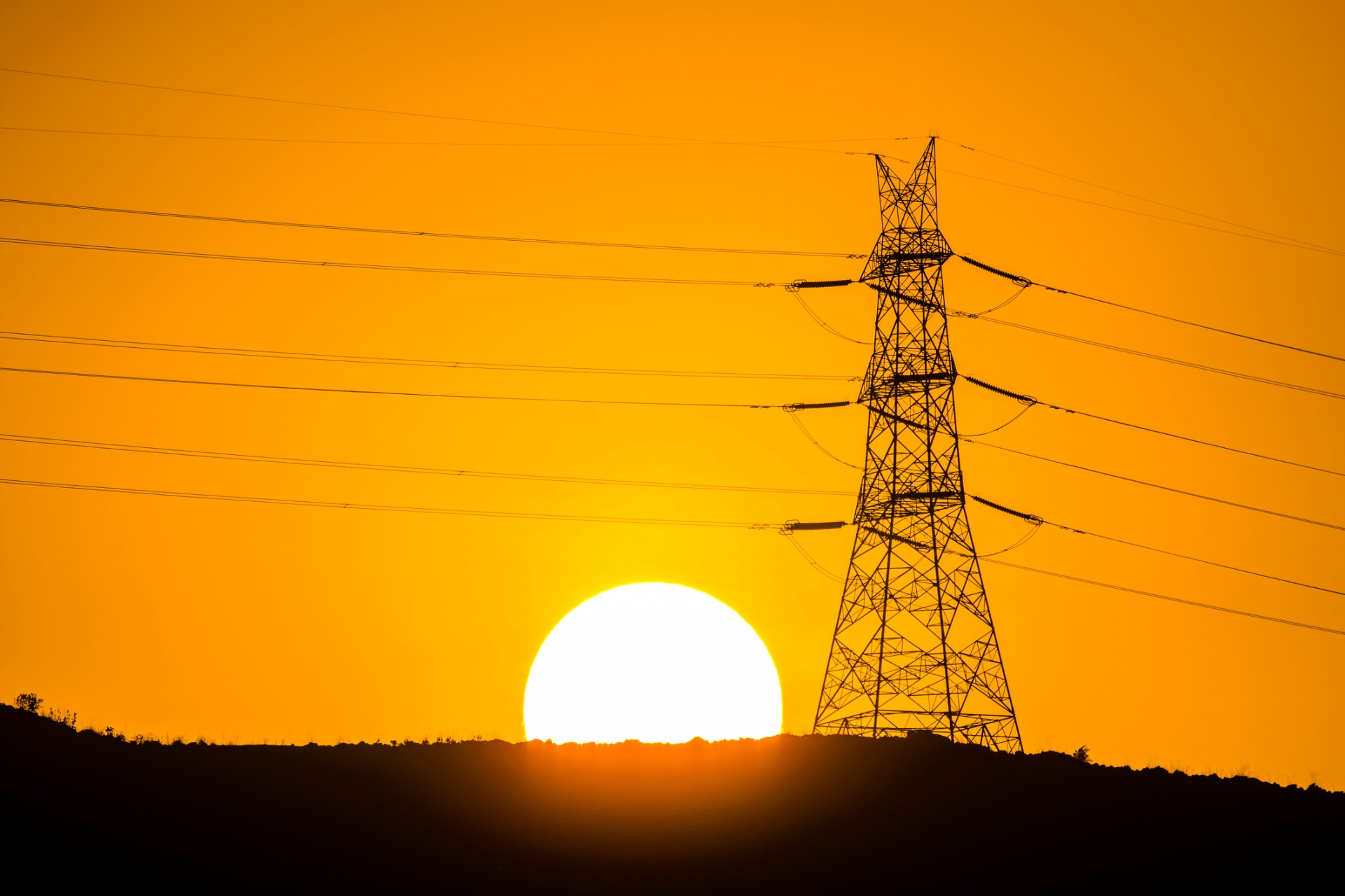Power transmission tower and its power cables installed over a hill in a village near Panvel, Navi Mumbai.