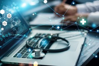 Healthcare business graph data and growth, Insurance Healthcare. Doctor analyzing medical of business report and medical examination with network connection on laptop screen.