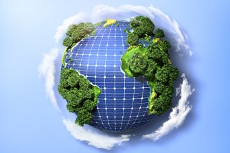 Concept of green solar energy. Green planet earth with trees and solar panels in the ocean.